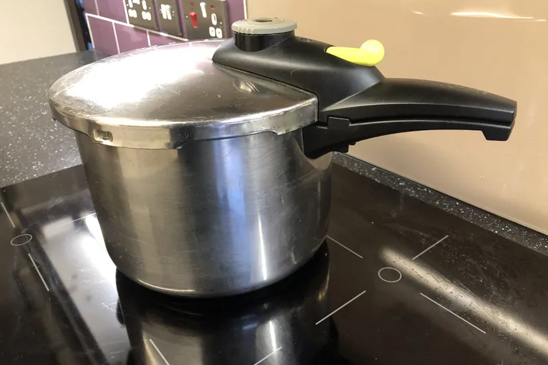 pressure cook sitting on an induction hob