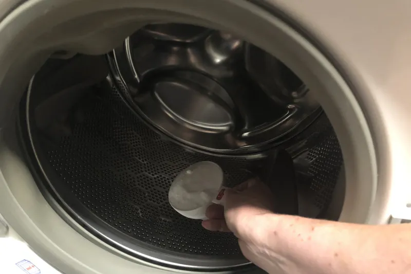 adding soap to the washing machine