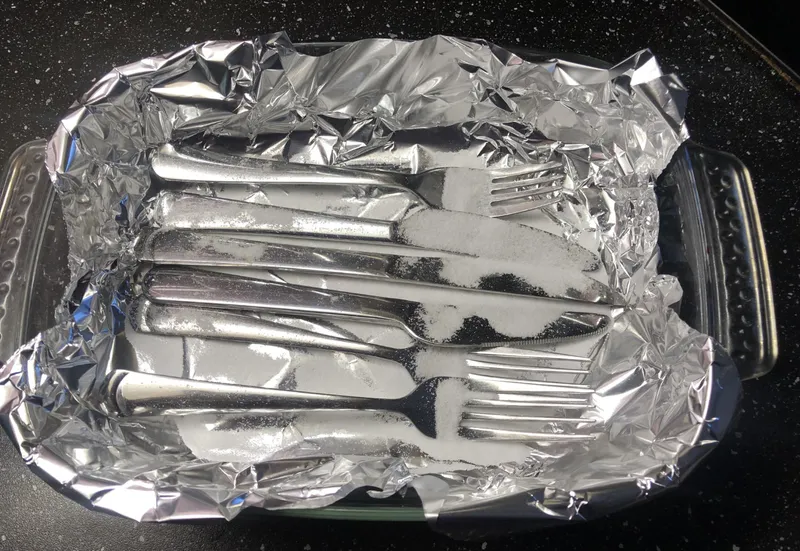baking soda sprinkled on the cutlery