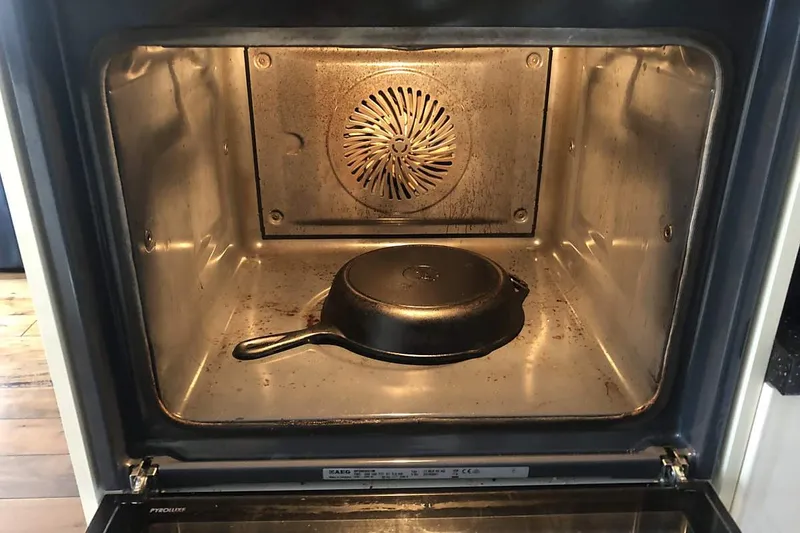 cast iron skillet in the oven ready for self-cleaning cycle