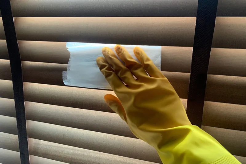 cleaning blinds with a dryer sheet