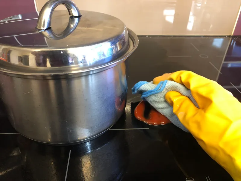 cleaning up a spill on the induction hob