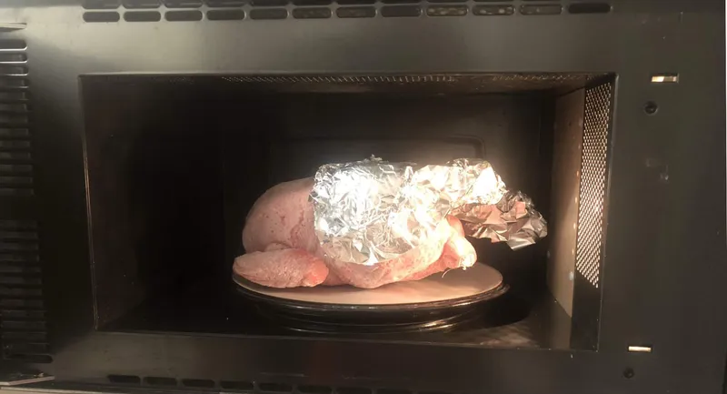 frozen chicken in microwave with foil on the legs