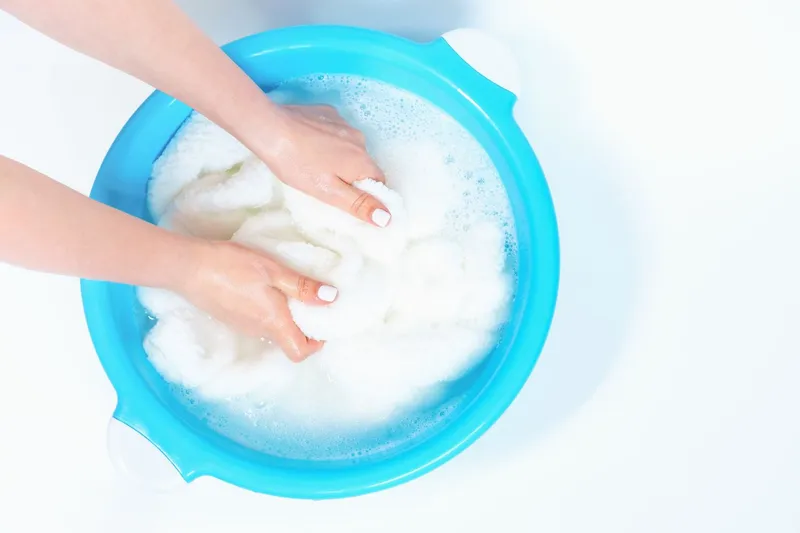 hand washing a bath mat