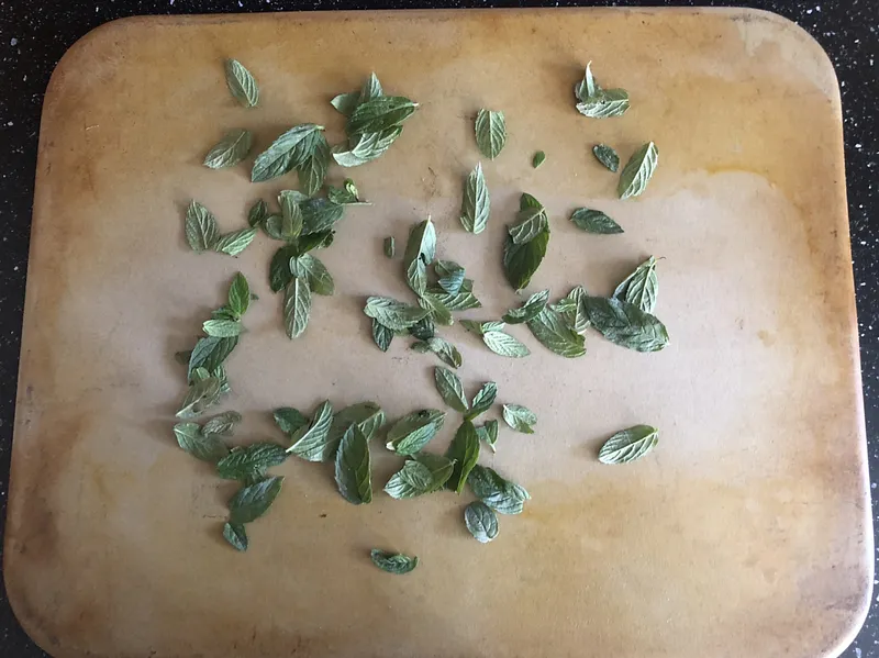 mint leaves on a baking sheet