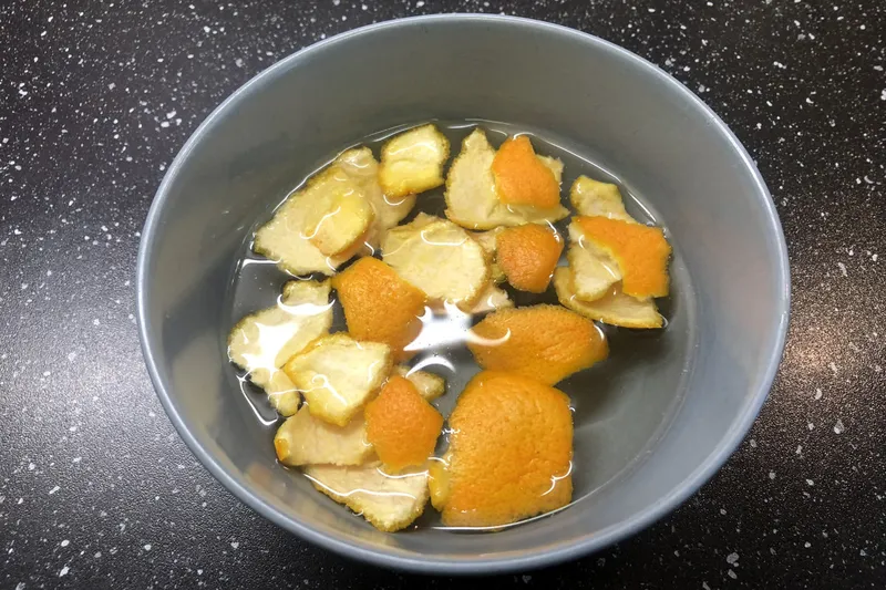 orange peels in a bowl of water