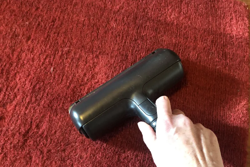 removing hair from a carpet with a pet hair roller