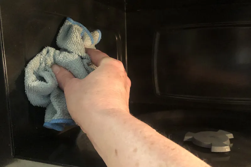wipe the inside of the microwave with a microfiber cloth