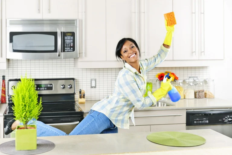 woman getting fit while cleaning the kitchen