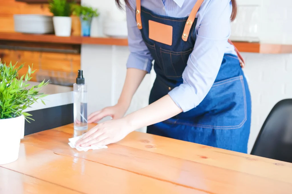 woman wiping a surface
