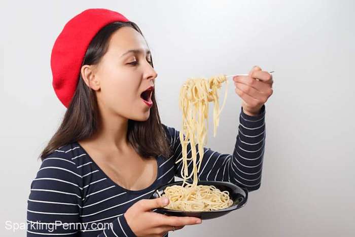 woman enjoying pasta