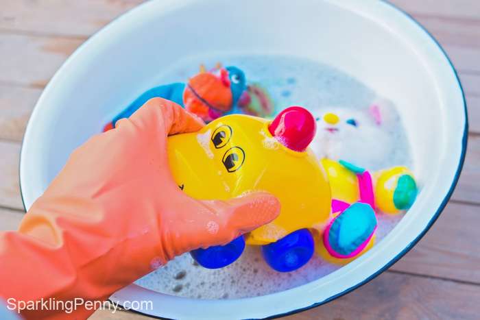washing toys in soap and water