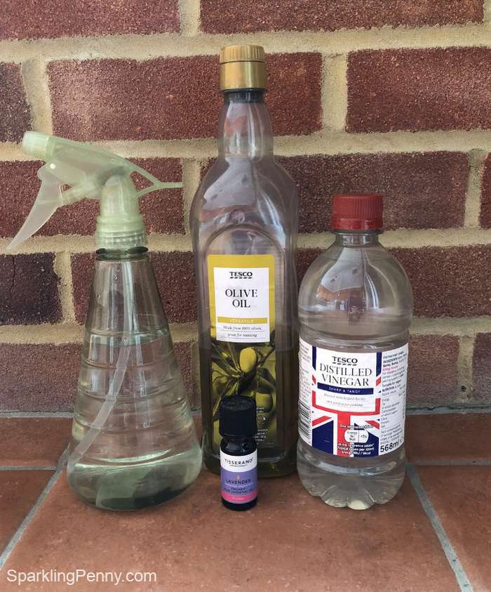 vinegar, olive oil and spray bottle for DIY dusting spray