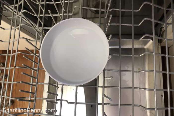 bowl of vinegar on the top rack of a dishwasher
