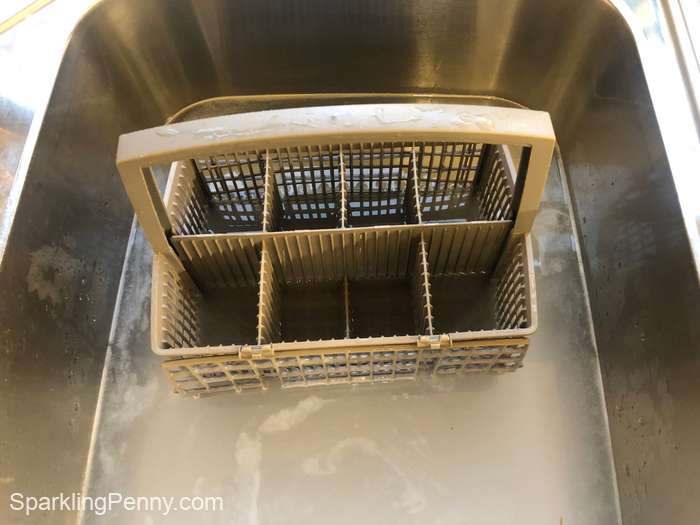 dishwasher basket soaking in the sink