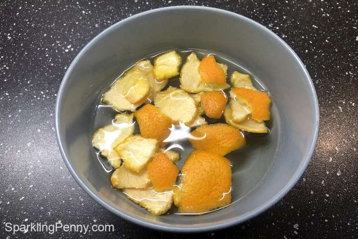 orange peels in a bowl of water