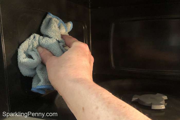 wipe the inside of the microwave with a microfiber cloth