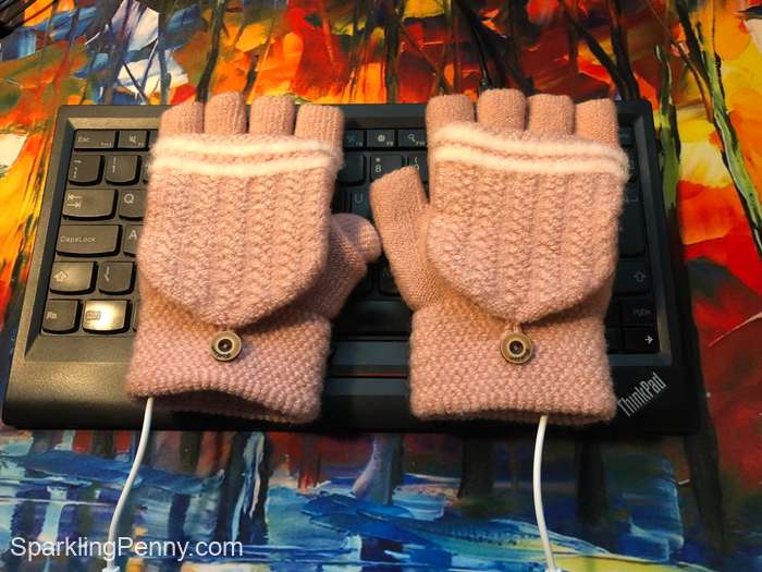 usb heated glove on top of keyboard