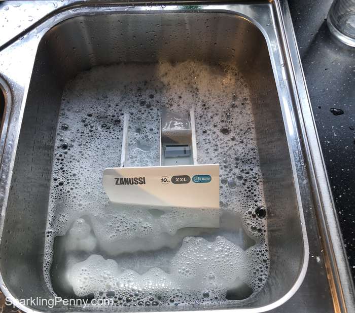 detergent drawer soaking in the sink