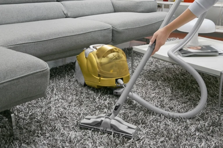 vacuuming a carpet